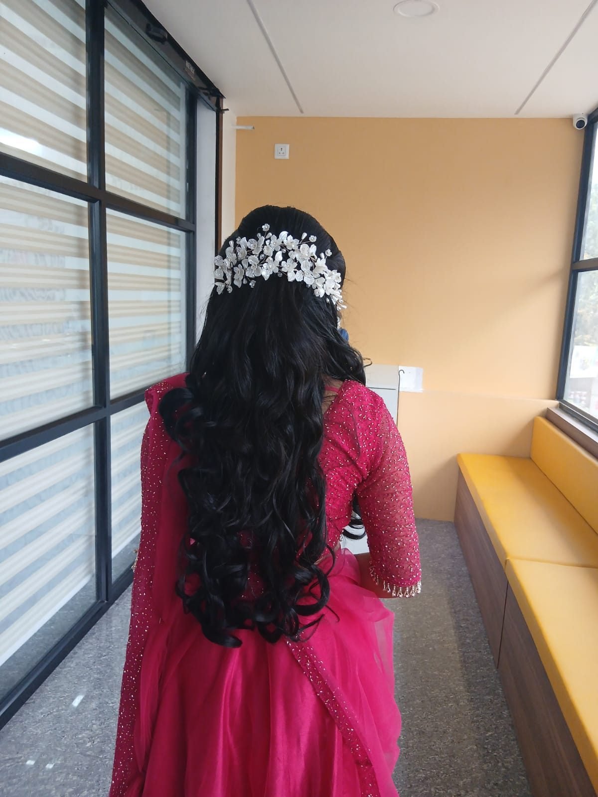 Bridal hairstyling detail with pearl hair accessory