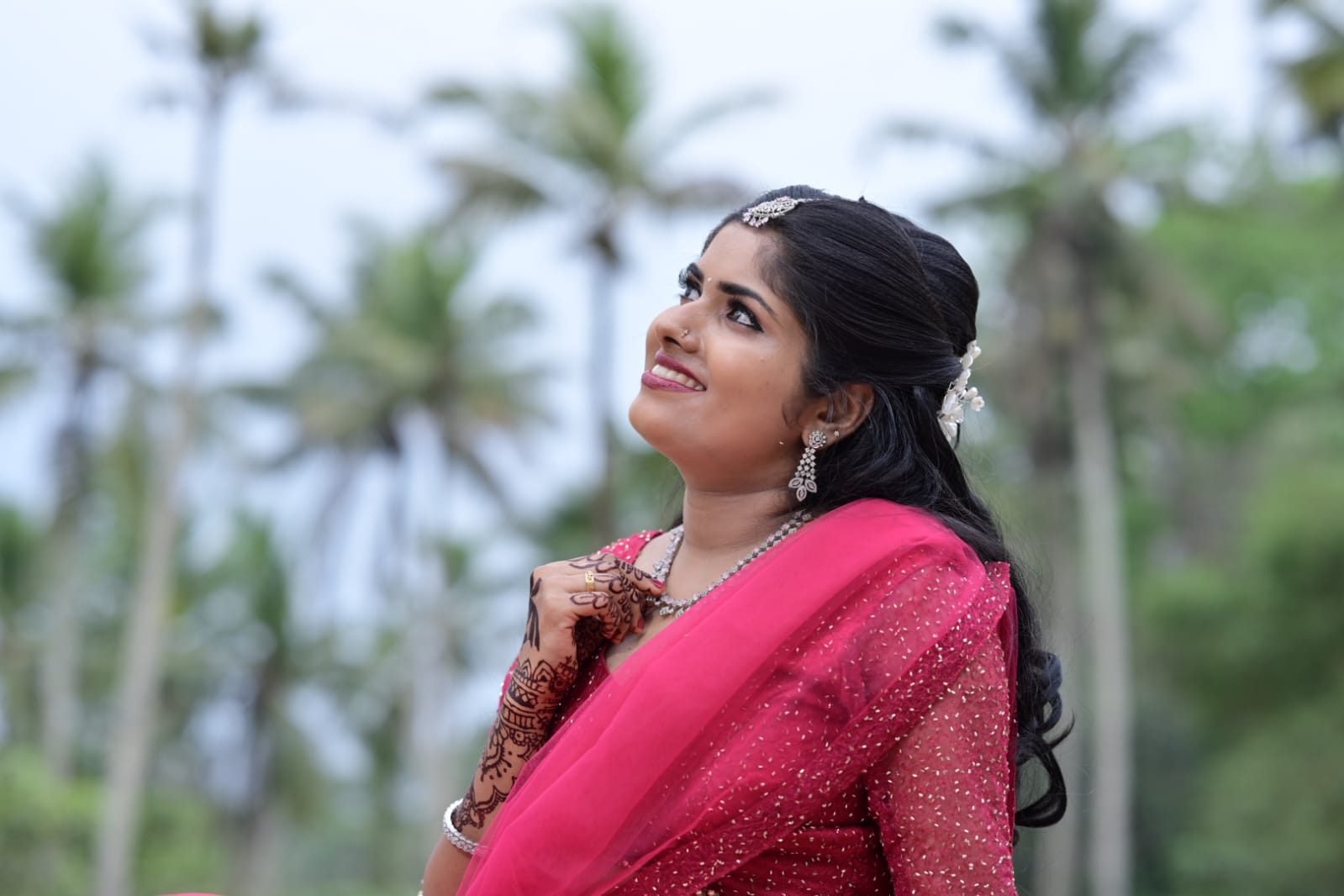 Bridal client glowing look in pink saree outdoors