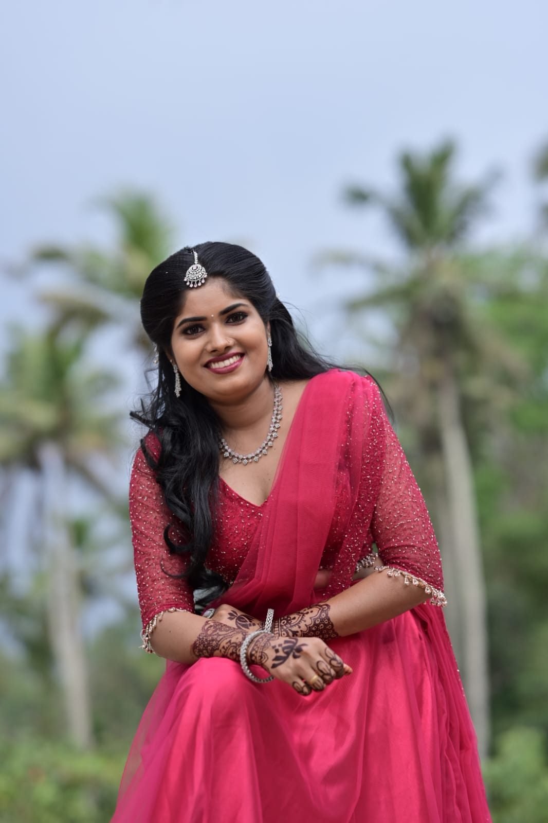 Occasion makeup look in pink outfit outdoors